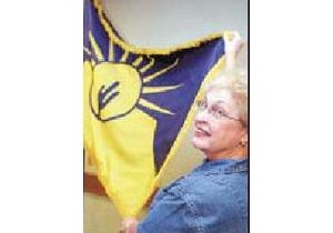 Winning flag in Tribune’s contest adopted 