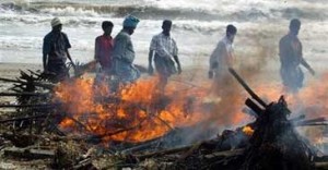 Asia rushes to bury bodies; death toll at 67,000 