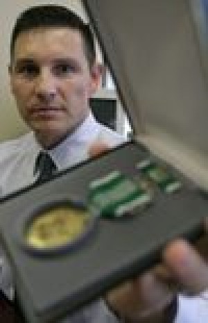 Army officer downplays Afghan heroism 