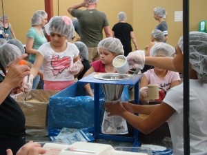 Riggs Elementary students make 4,000 meals for starving children