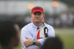 High school coach charged in player's death 