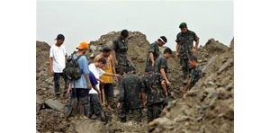 Rescuers search for landslide survivors 