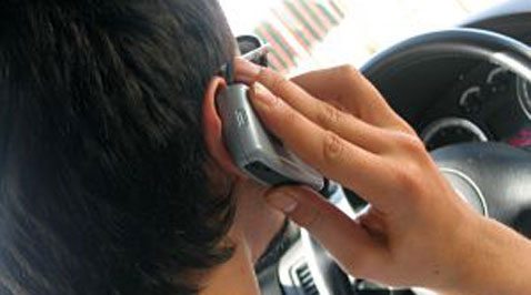 Bill bans cell phone use while driving 
