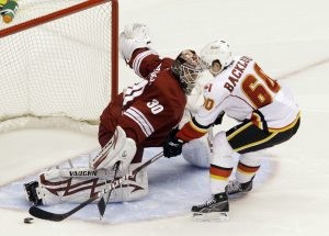 Coyotes blow lead but top Flames in shootout 