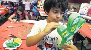 E.V. students decorating U.S. Christmas Tree 