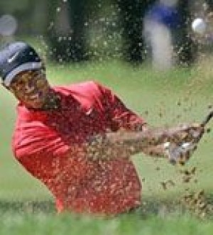Tiger Woods easily captures 12th major title 