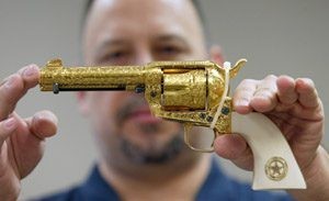 IRS to auction commemorative, gold-plated pistols 