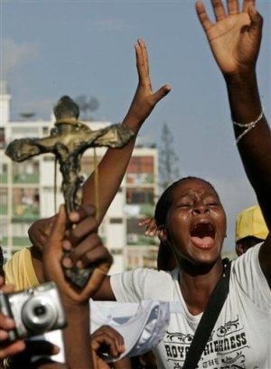 Pope urges Angolans to convert; stampede kills 2 