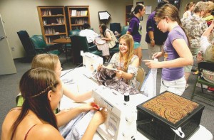 Girl Scouts make dresses for Swaziland