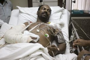 Mumbai cop, left for dead, rides with gunmen 