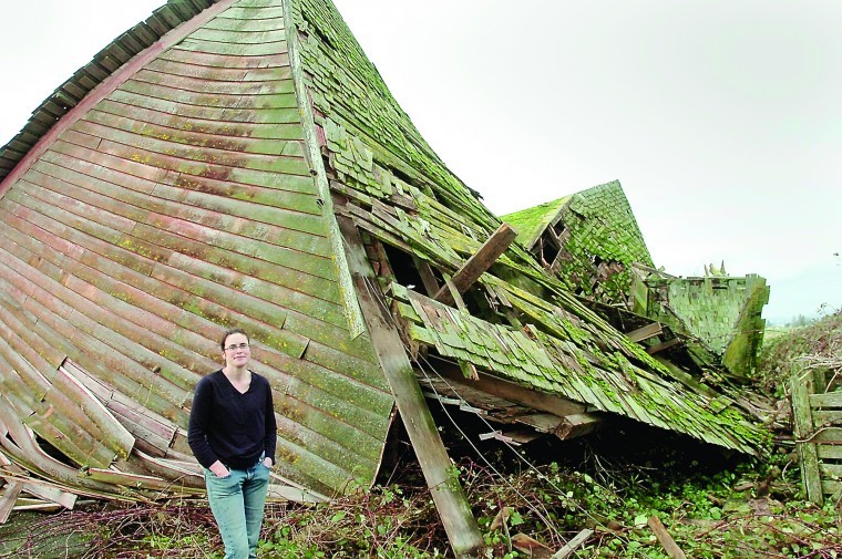 <p>Kelly Graham stands in front of her family's barn which was
blown down during a violent windstorm Tuesday evening. It was known
as the Nelson barn, which was built in 1938. The structure was on
the Washington Heritage Barn registry. The Graham's bought the
property off Beaver March Road in 2002.</p>
