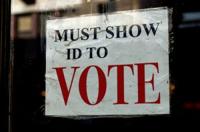 The state Department of Justice doesn't want highest court to take up voter ID case.