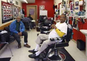 Mr. Smitty (seated in chair) and his barber shop in South Madison are ...