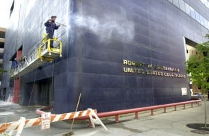 Workers prepare the federal courthouse in Madison for a fresh coat of paint in this file photo. Workers who are discriminated against in Wisconsin can still seek justice from state and federal agencies as well as federal court.
