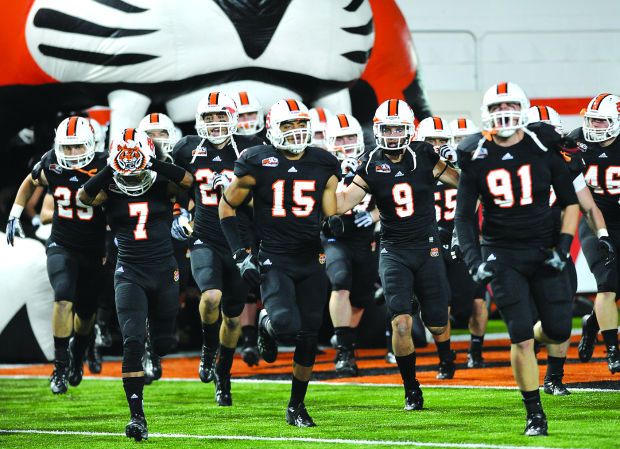 Journal File Photo The Idaho State Football Team Runs On The Field In ...