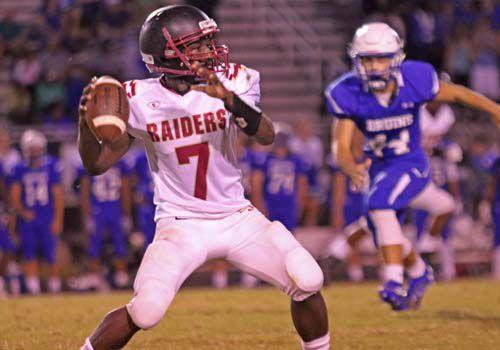 Stonewall Jackson quarterback Cameron Brown drops back to pass against Forest Park on Friday, Sept. 16, 2016. - Inside NoVA