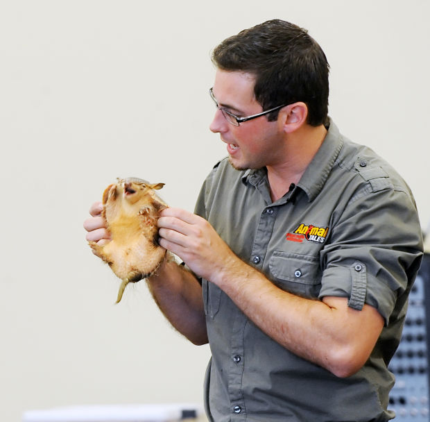 John Ham of Animal Tales holds a Screaming Hairy Armadillo