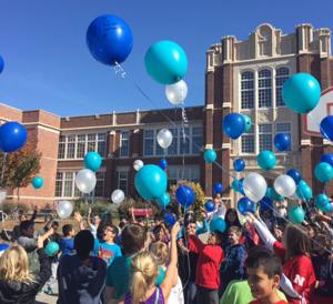 Balloons float into the sky Friday to remember Clinton student who died unexpectedly