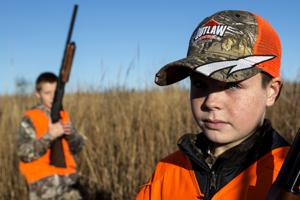 Fathers and sons bond during youth pheasant hunt event
