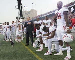NU president defends players' right to kneel following critical comments from regent