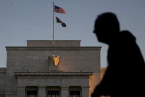 Fed cautiously keeps interest rate near zero