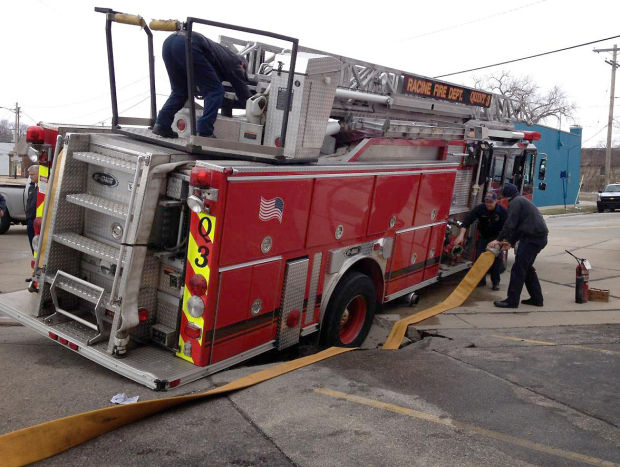 Fire truck gets stuck in sinkhole