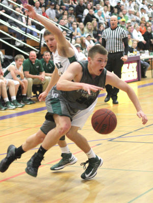 Boys Basketball: Hawks Outlast Falcons In Overtime, Advance To Section Championship : Michael Meserole of the Liberty Ranch Hawks outmaneuvers a Colfax Falcons defender as he heads to the paint at Tokay High School on Wednesday, Feb. 27, 2013. The Hawks beat the Falcons 64-59 in overtime to advance to the Sac-Joaquin Section Division IV championship against the Summerville Bears of Tuolumne at Sleep Train Arena in Sacramento on Saturday, March 2, 2013.
 - Photo by Jerry R. Tyson/News-Sentinel