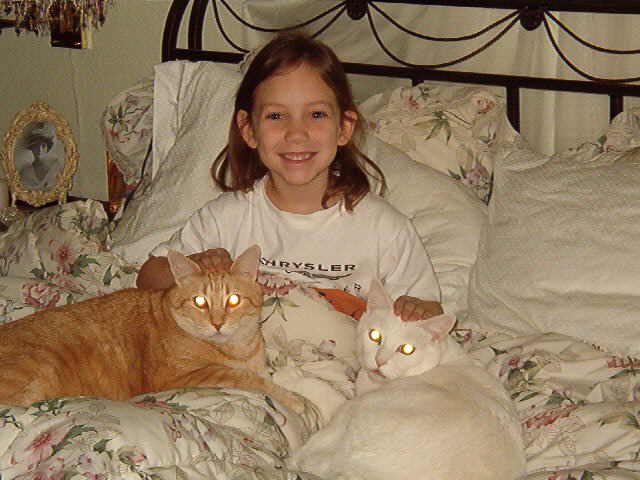 Grand daughter Sierra takes Cats for a Nap.....