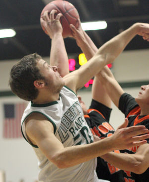 Boys basketball: Hawks hold off Cougars and make history