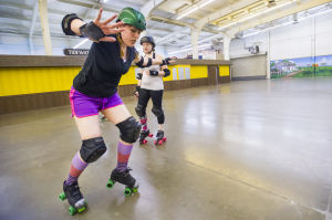 Reporter Skates After Her Derby Girl Dreams : News-Sentinel reporter Sara Jane Pohlman balances herself to keep from falling while skating with the Port City Roller Girls roller derby team at the San Joaquin County Fairgrounds on Thursday, Feb. 7, 2013.
 - Photo by Dan Evans/News-Sentinel