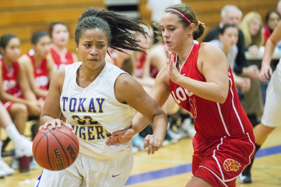 Tigers defeat rival Flames in preseason girls basketball opener 
