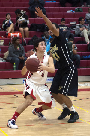 Boys basketball: Flames topple Titans