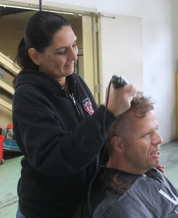 Lodi firefighters shave head to support breast cancer research 
