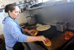 Breakfast burritos, cactus at restaurant inside gas station 