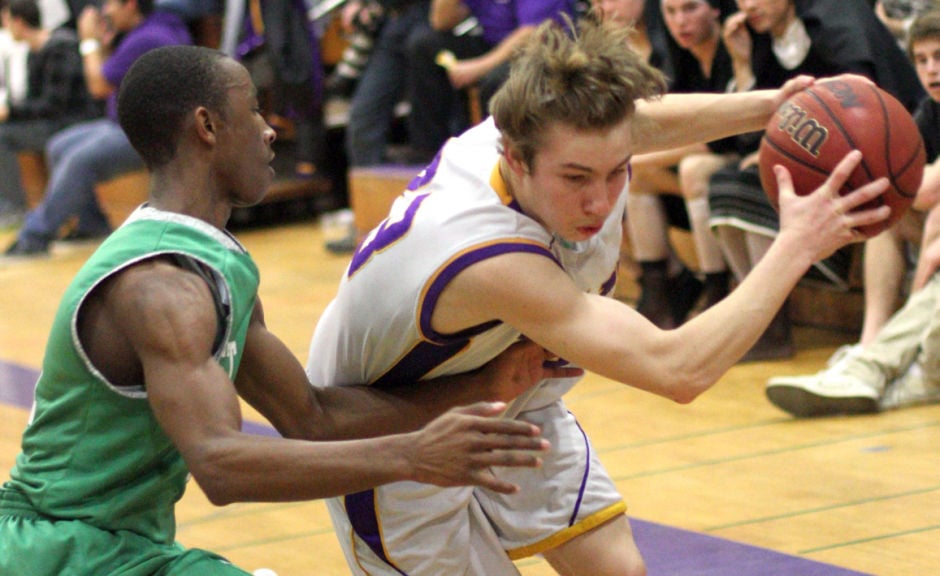 Boys basketball: Tigers hang tough for a half, but Rams pull away 