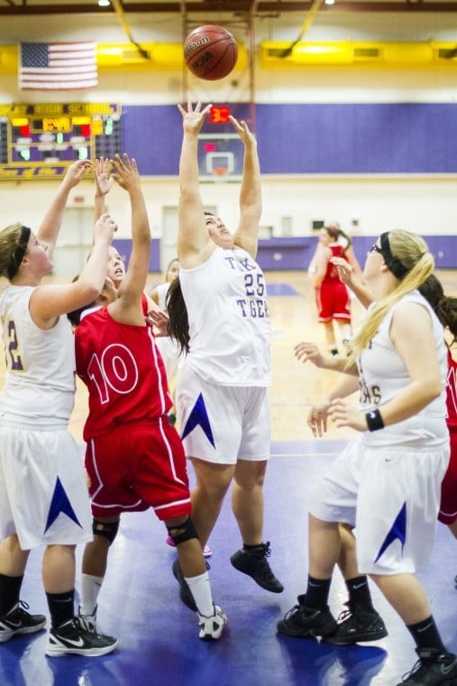 Tigers defeat rival Flames in preseason girls basketball opener 