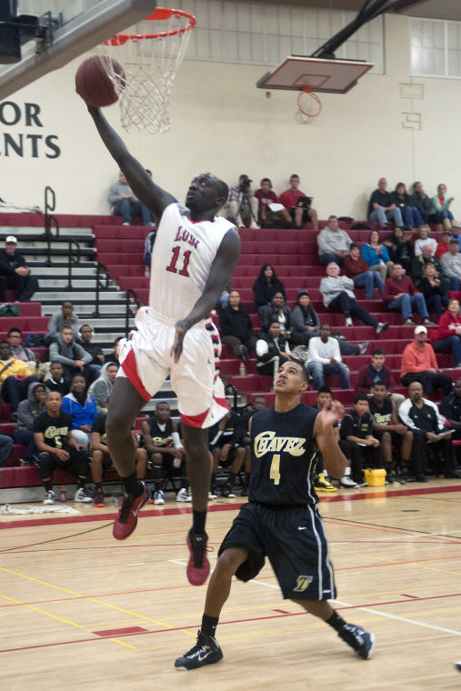 Boys basketball: Flames topple Titans