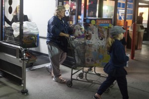 Lodi Shoppers Brave Black Friday Sales : A woman leaves Wal-Mart with a cart filled with children’s toys during the store’s early Black Friday sale in Lodi on Thursday, Nov. 22, 2012.
 - Photo by Ian Jonsson/News-Sentinel