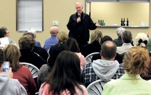 Father Michael Kelly speaks to supporters in Lockeford