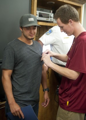 Teen gives awards to Clements firefighters, EMTs who saved his life