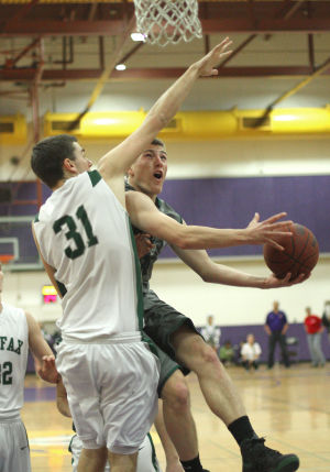 Boys Basketball: Hawks Outlast Falcons In Overtime, Advance To Section Championship : Michael Meserole of the Liberty Ranch Hawks takes the ball to the basket against Will Buell of the Colfax Falcons at Tokay High School on Wednesday, Feb. 27, 2013. The Hawks beat the Falcons 64-59 in overtime to advance to the Sac-Joaquin Section Division IV championship against the Summerville Bears of Tuolumne at Sleep Train Arena in Sacramento on Saturday, March 2, 2013.
 - Photo by Jerry R. Tyson/News-Sentinel