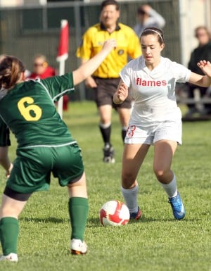 Despite loss in league opener, Flames still shooting for girls soccer title