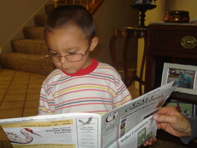 My Grandson David catching up on the news!