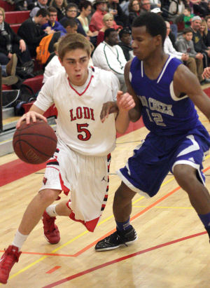 Boys basketball: Flames survive Bruins’ comeback 