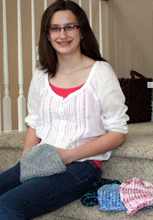 Brianne Wild knits beanies for cancer patients