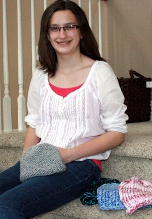 Brianne Wild knits beanies for cancer patients