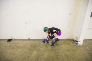 Reporter Skates After Her Derby Girl Dreams : News-Sentinel reporter Sara Jane Pohlman struggles to stand while wearing roller skates. Pohlman practiced with the Port City Roller Girls roller derby team at the San Joaquin County Fairgrounds on Thursday, Feb. 7, 2013.
 - Photo by Dan Evans/News-Sentinel