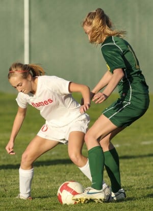 Despite loss in league opener, Flames still shooting for girls soccer title