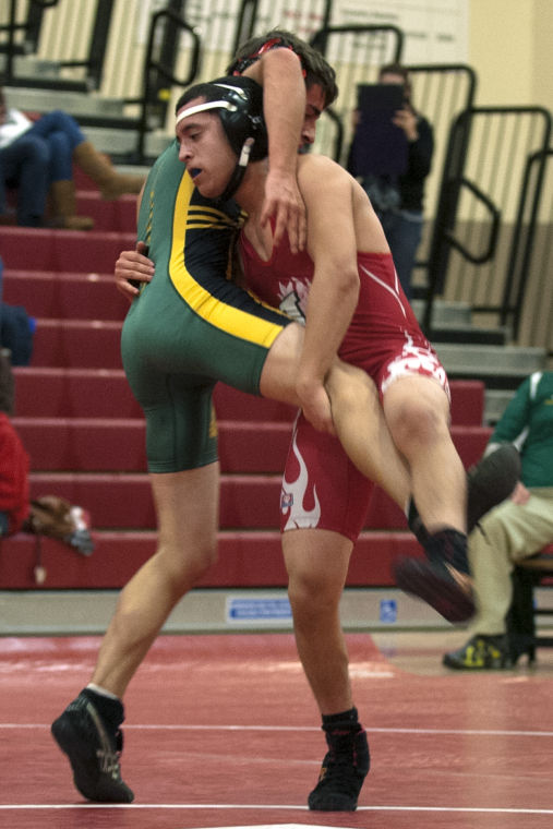 Wrestling: Flames rumble past Bulldogs 