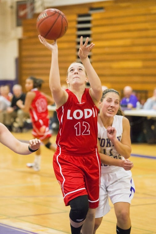 Tigers defeat rival Flames in preseason girls basketball opener 